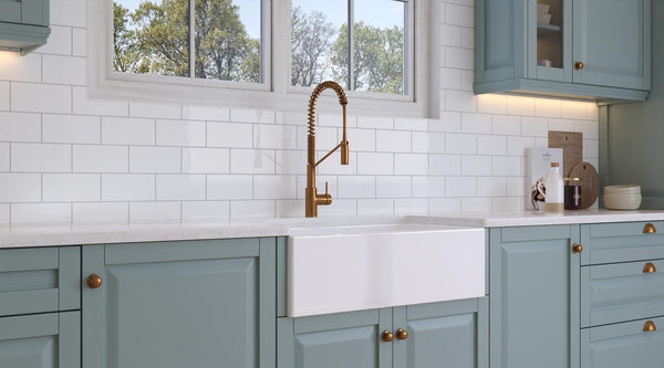 The Burly Fine Fireclay 36" Fine Fireclay Apron Front Farmhouse Reversible Single Bowl Kitchen Sink in Glossy White lifestyle image features a spacious and durable plain front sink offering both style and functionality. Available in single bowl models, its deep basin accommodates various kitchen tasks. Its sleek, modern design adds sophistication to any kitchen space. Model:BS361808SBR